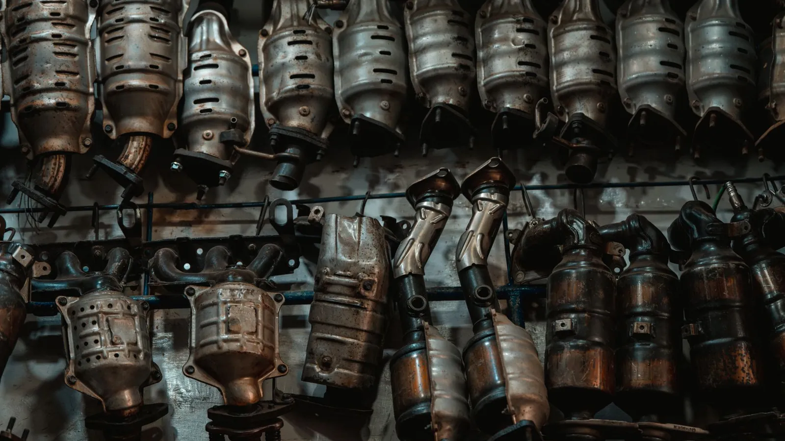 Stack of used catalytic converters in a workshop