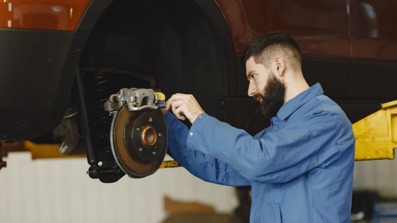 Mechanic working on a car brake system