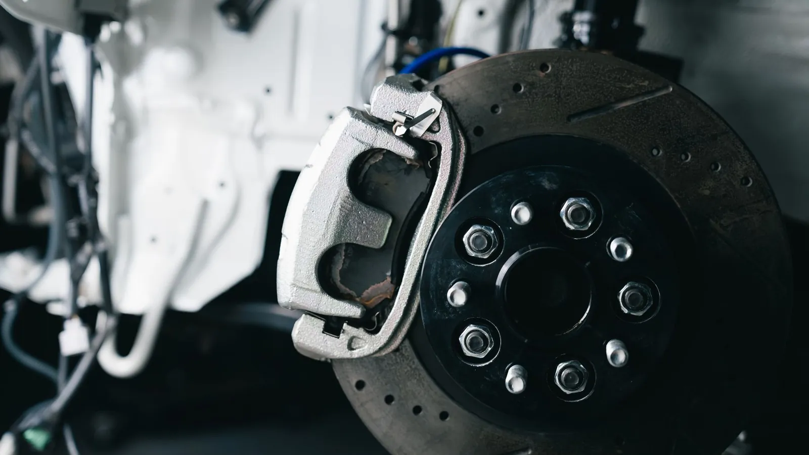 New brake disc and caliper fitted to a car